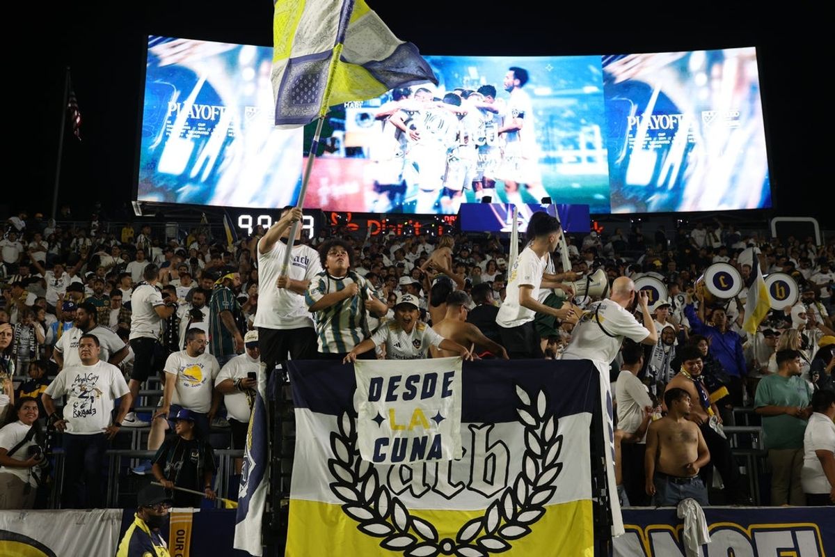 Sep 14, 2024; Carson, California, USA; Los Angeles Galaxy fans celebrate after the match against the LAFC at Dignity Health Sports Park. Mandatory Credit: Kiyoshi Mio-Imagn Images