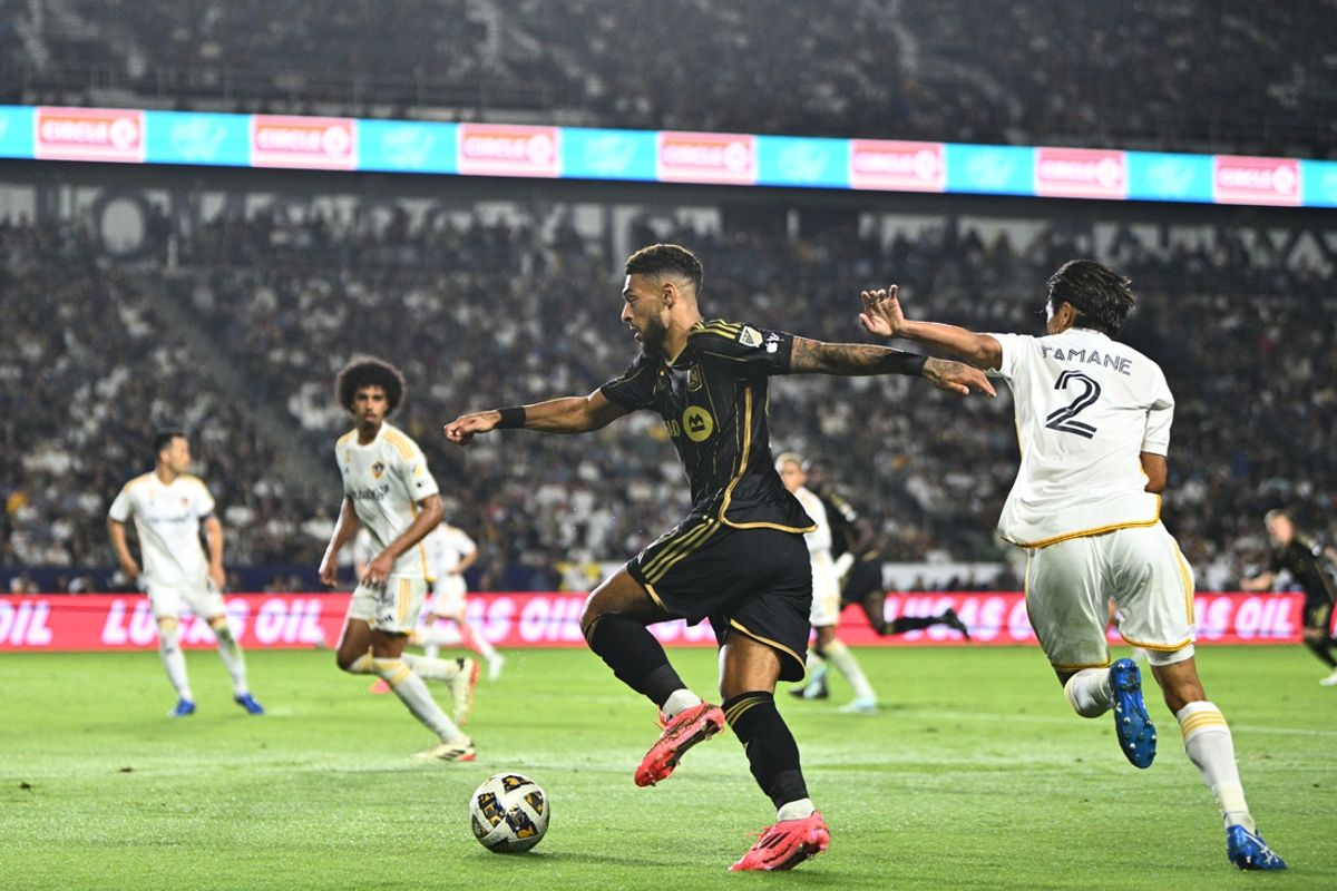 Sep 14, 2024; Carson, California, USA; LAFC forward Denis Bouanga (99) plays the ball defende day Los Angeles Galaxy defender Miki Yamane (2) second half at Dignity Health Sports Park. Mandatory Credit: Kelvin Kuo-Imagn Images