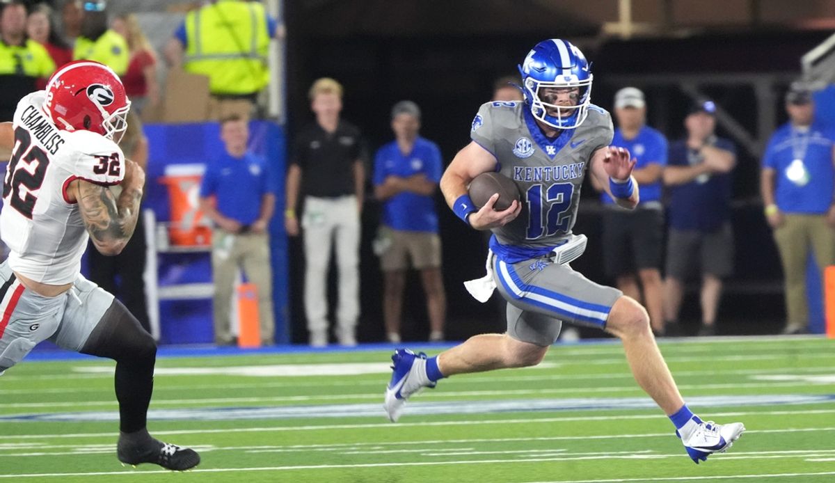 Kentucky’s Brock Vandagriff runs for a first down against Georgia’s Chaz Chambliss Saturday night.
Sept. 14, 2024