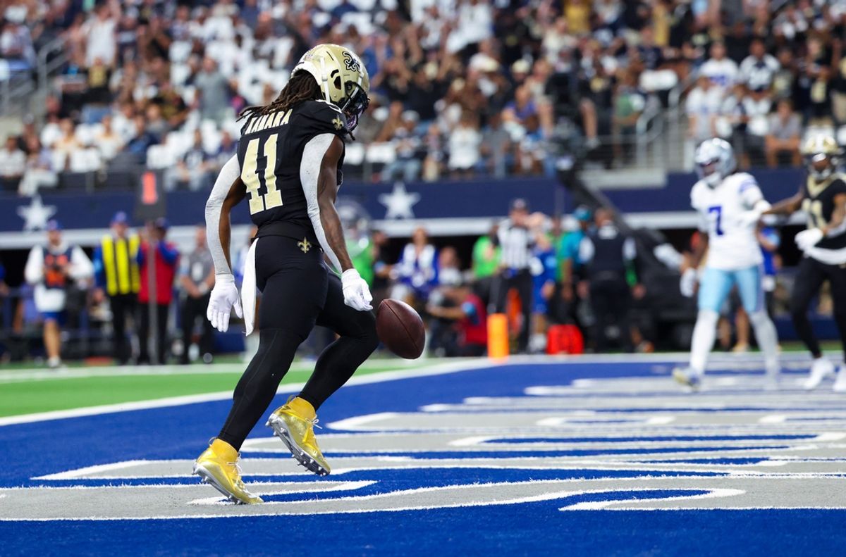 Sep 15, 2024; Arlington, Texas, USA;  New Orleans Saints running back Alvin Kamara (41) scores a touchdown  during the first quarter against the Dallas Cowboys at AT&T Stadium. Mandatory Credit: Kevin Jairaj-Imagn Images