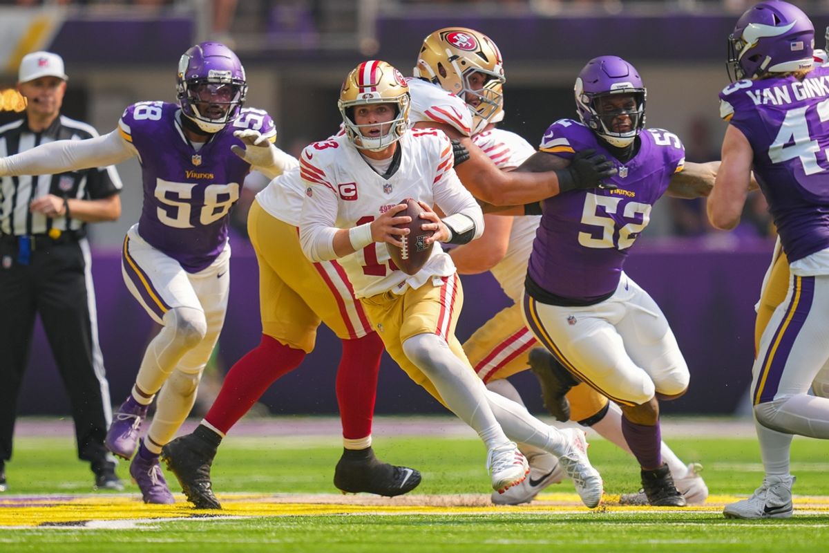 Sep 15, 2024; Minneapolis, Minnesota, USA; San Francisco 49ers quarterback Brock Purdy (13) scrambles against the Minnesota Vikings in the second quarter at U.S. Bank Stadium. Mandatory Credit: Brad Rempel-Imagn Images