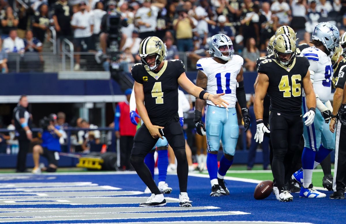 Sep 15, 2024; Arlington, Texas, USA; New Orleans Saints quarterback Derek Carr (4) celebrates after scoring a touchdown  during the first half against the Dallas Cowboys at AT&T Stadium. Mandatory Credit: Kevin Jairaj-Imagn Images