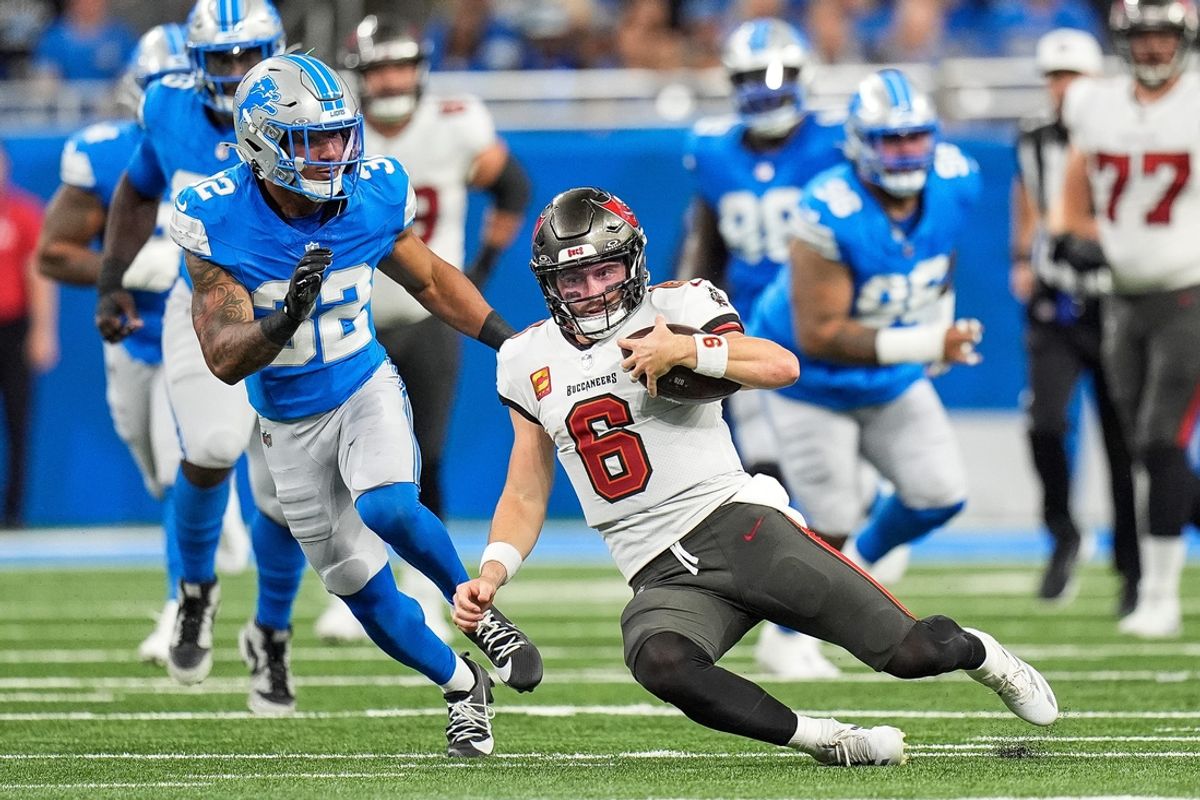Tampa Bay Buccaneers quarterback Baker Mayfield (6) slides for a first down against Detroit Lions during the first half at Ford Field in Detroit on Sunday, September 15, 2024.