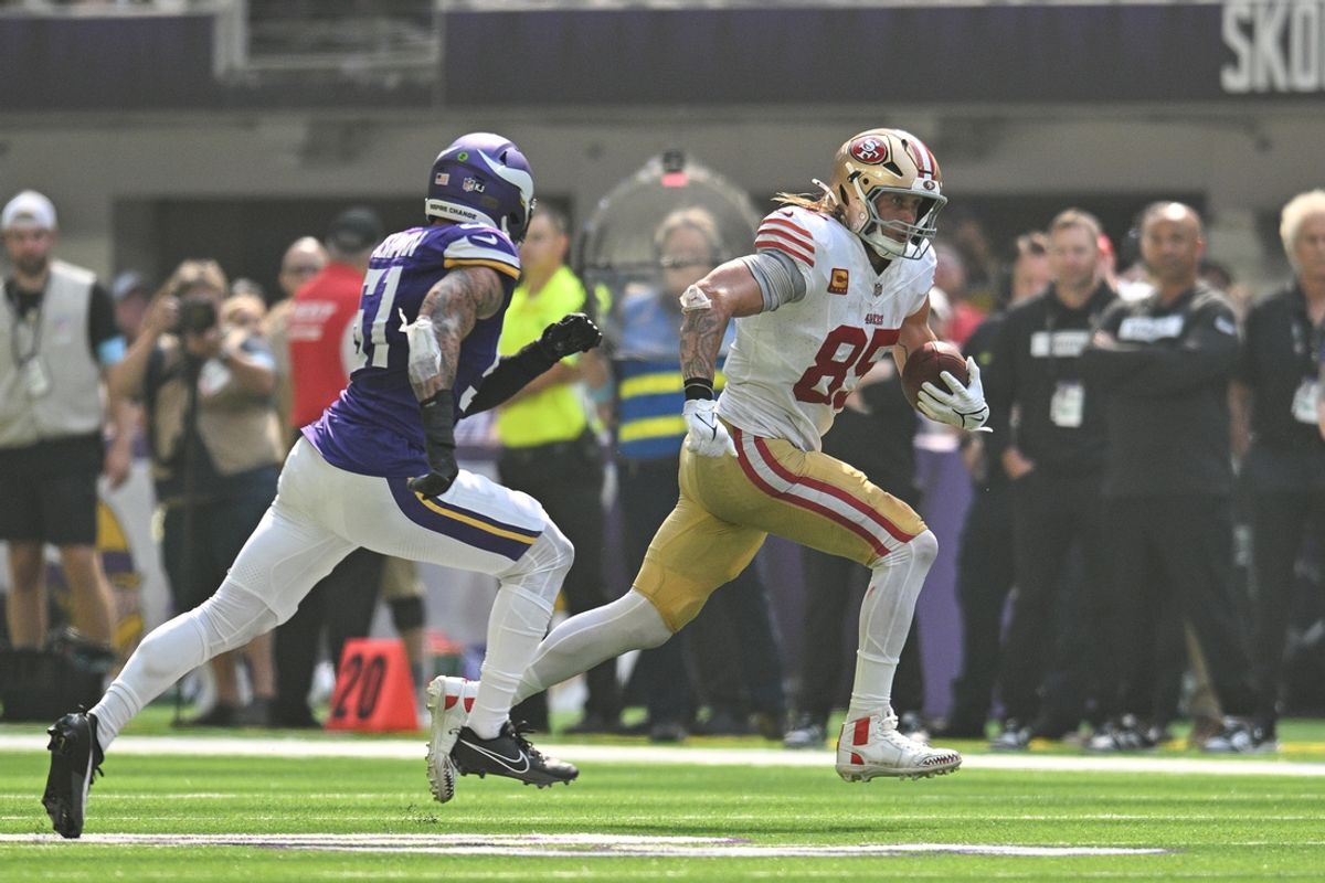 Sep 15, 2024; Minneapolis, Minnesota, USA; San Francisco 49ers tight end George Kittle (85) runs for yards after catch as Minnesota Vikings linebacker Blake Cashman (51) pursues during the second quarter U.S. Bank Stadium. Mandatory Credit: Jeffrey Becker-Imagn Images