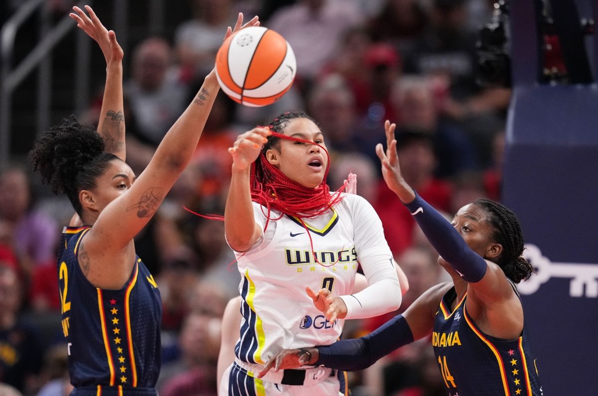 Dallas Wings forward Satou Sabally (0) passes the ball against Indiana Fever center Temi Fagbenle (14) on Sunday, Sept. 15, 2024, during the game at Gainbridge Fieldhouse in Indianapolis.