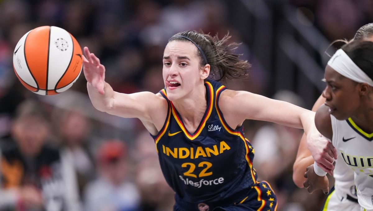 Indiana Fever guard Caitlin Clark (22) reaches for the ball Sunday, Sept. 15, 2024, during the game at Gainbridge Fieldhouse in Indianapolis.