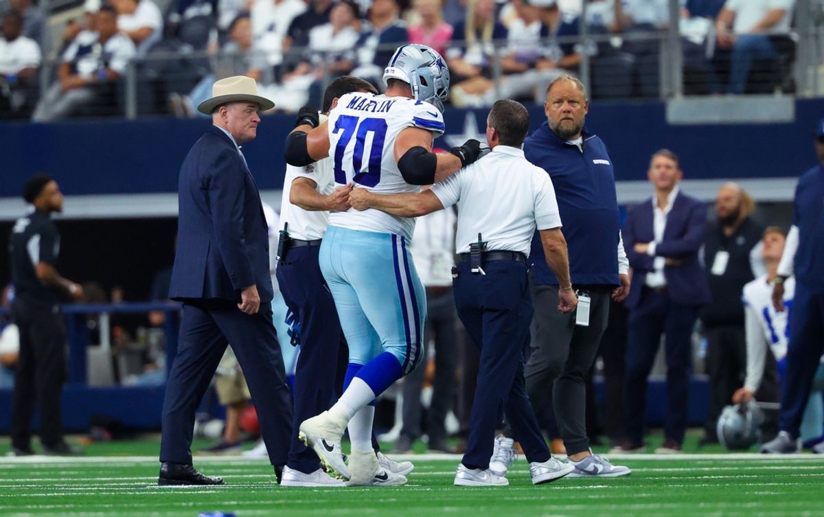 Sep 15, 2024; Arlington, Texas, USA; Dallas Cowboys guard Zack Martin (70) walsk off injured during the second half against the New Orleans Saints at AT&T Stadium. Mandatory Credit: Kevin Jairaj-Imagn Images