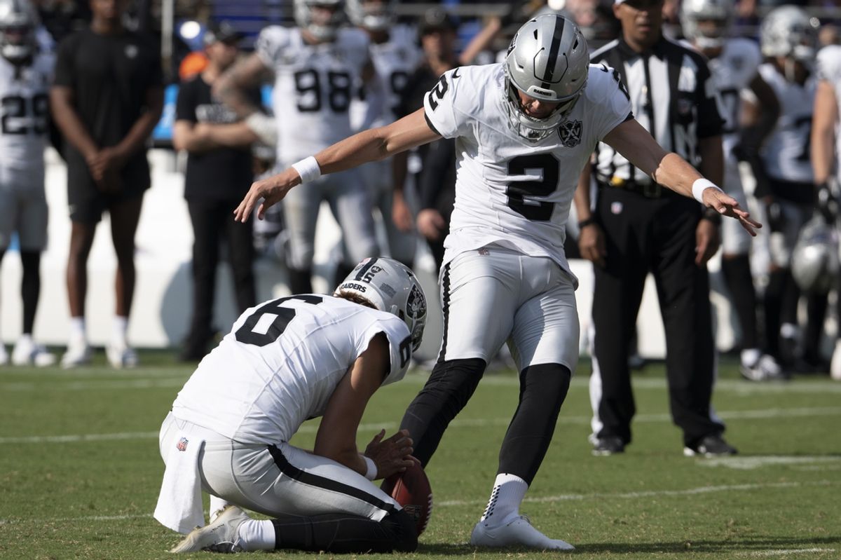 Sep 15, 2024; Baltimore, Maryland, USA; Las Vegas Raiders place kicker Daniel Carlson (2) kicks a game winning field goal  during the second half against the Baltimore Ravens at M&T Bank Stadium. Mandatory Credit: Tommy Gilligan-Imagn Images