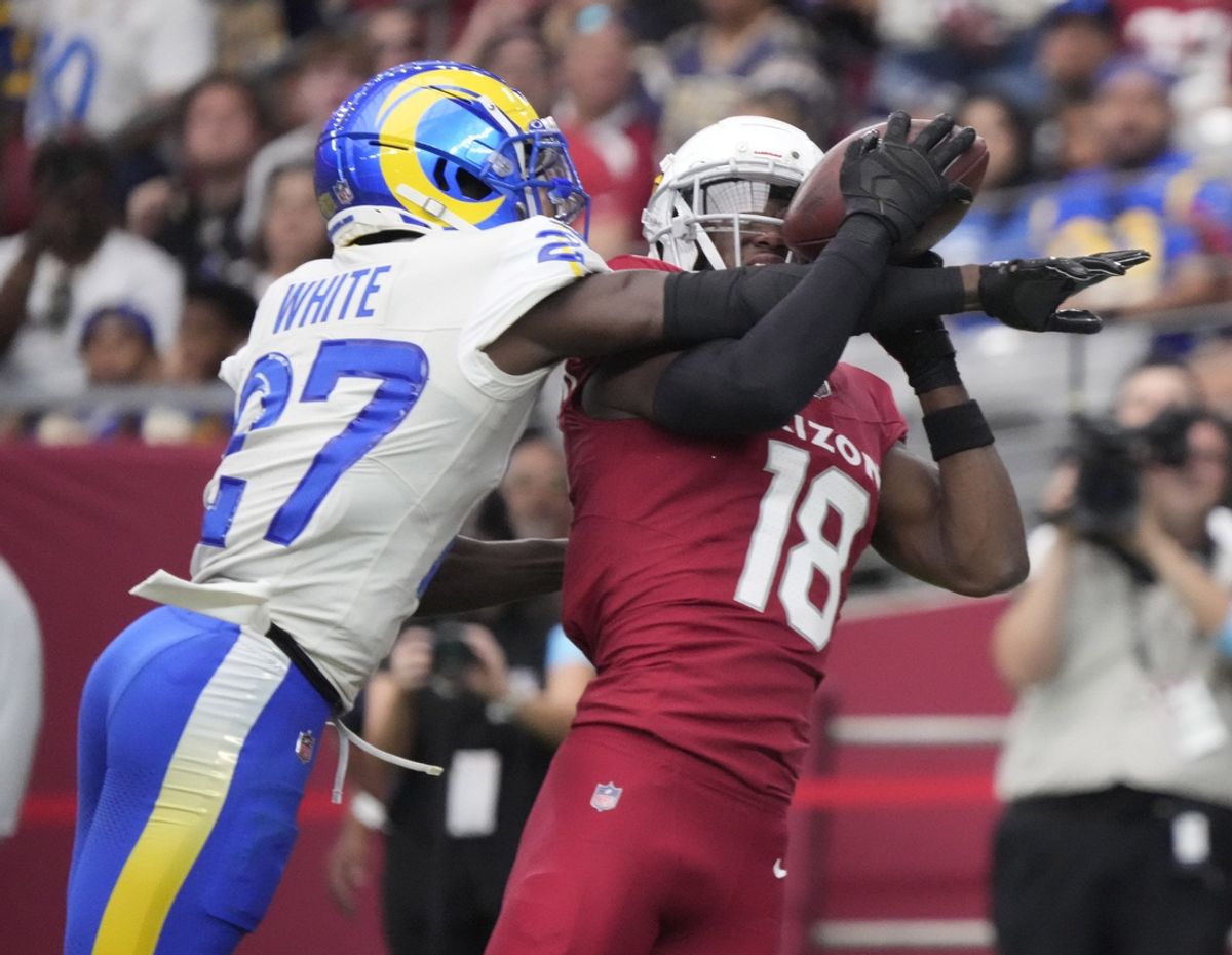 Arizona Cardinals wide receiver Marvin Harrison Jr. (18) catches a touchdown against Los Angeles Rams cornerback Tre'Davious White (27) during the first quarter at State Farm Stadium on Sept. 15, 2024.