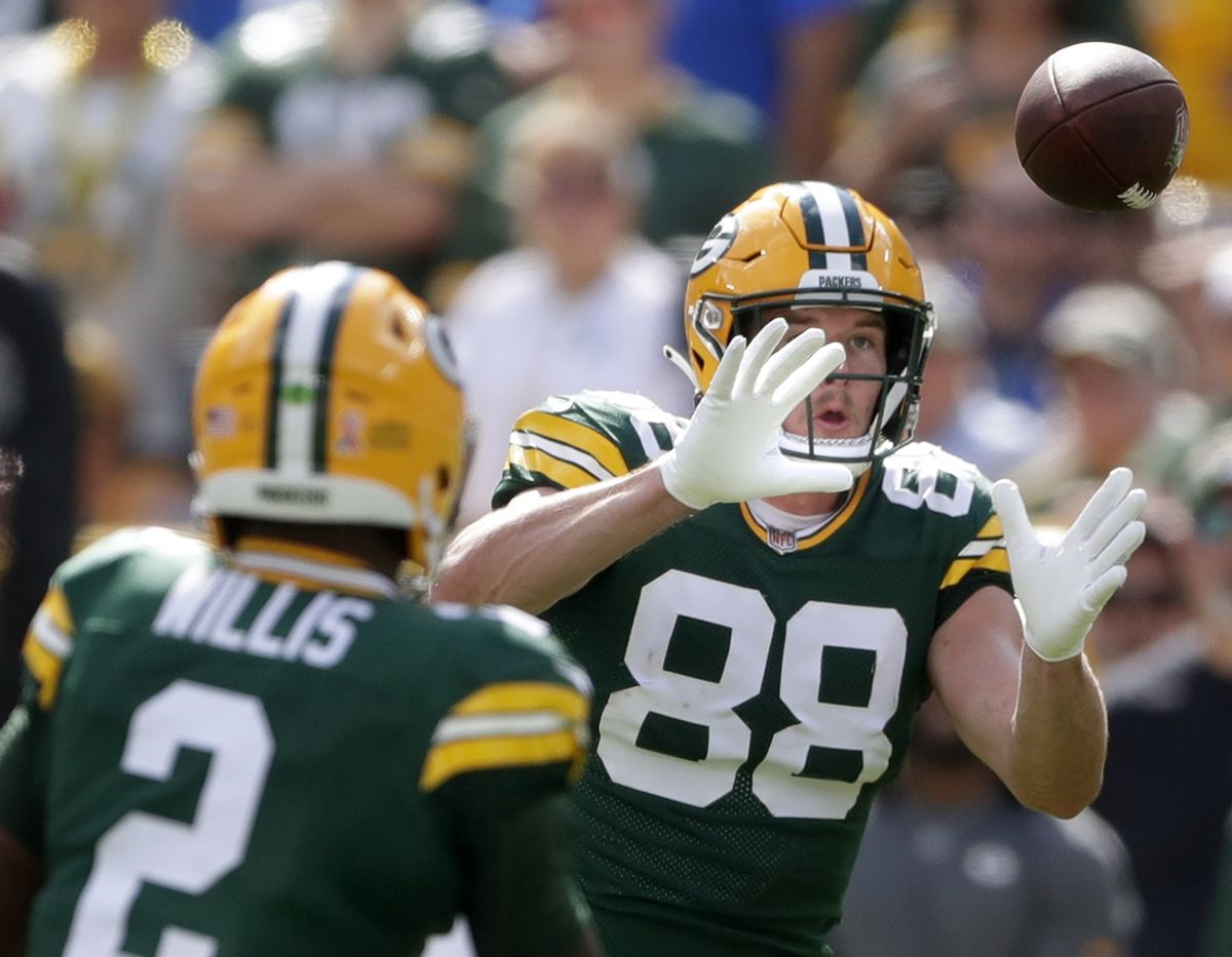 Sep 15, 2024; Green Bay, Wisconsin, USA;  Green Bay Packers tight end Luke Musgrave (88) catches a pass from Green Bay Packers quarterback Malik Willis (2) against the Indianapolis Colts at Lambeau Field. Mandatory Credit: Wm. Glasheen/USA TODAY Network via Imagn Images
