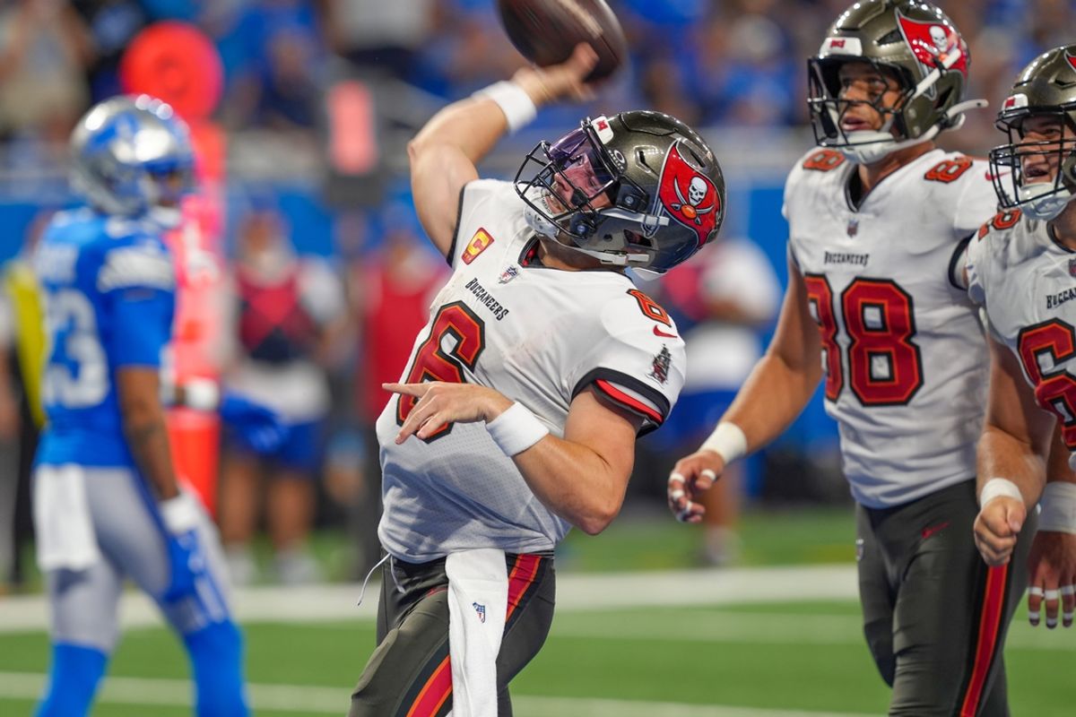 Tampa Bay Buccaneers quarterback Baker Mayfield (6) throws the balll into the stands after running for a touchdown during the second half of the N.F.L. game against the Detroit Lions at Ford Field in Detroit on Sunday, Sept. 15, 2024. Buccaneers won 20-16.