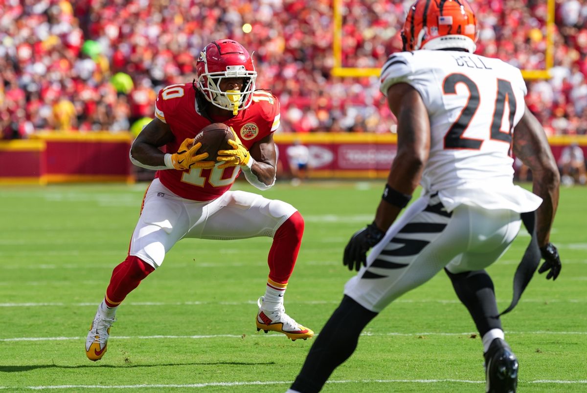 Sep 15, 2024; Kansas City, Missouri, USA; Kansas City Chiefs running back Isiah Pacheco (10) catches a pass against Cincinnati Bengals safety Vonn Bell (24) at GEHA Field at Arrowhead Stadium. Mandatory Credit: Jay Biggerstaff-Imagn Images