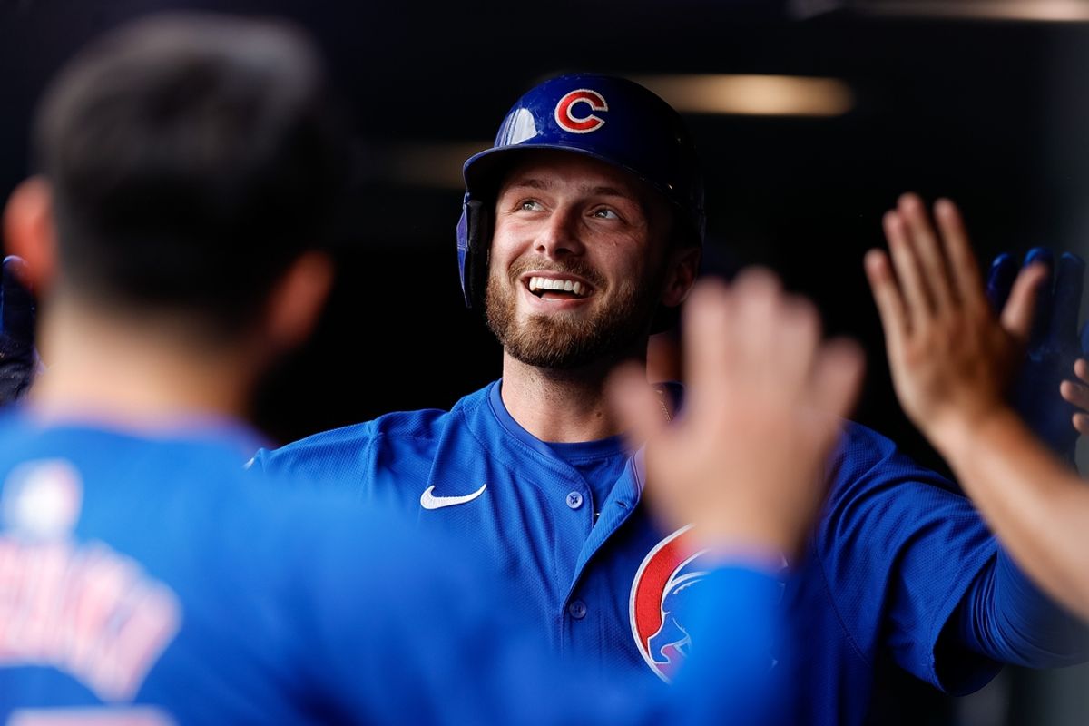 Sep 15, 2024; Denver, Colorado, USA; Chicago Cubs first baseman Michael Busch (29) celebrates in the dugout on a solo home run in the ninth inning against the Colorado Rockies at Coors Field. Mandatory Credit: Isaiah J. Downing-Imagn Images
