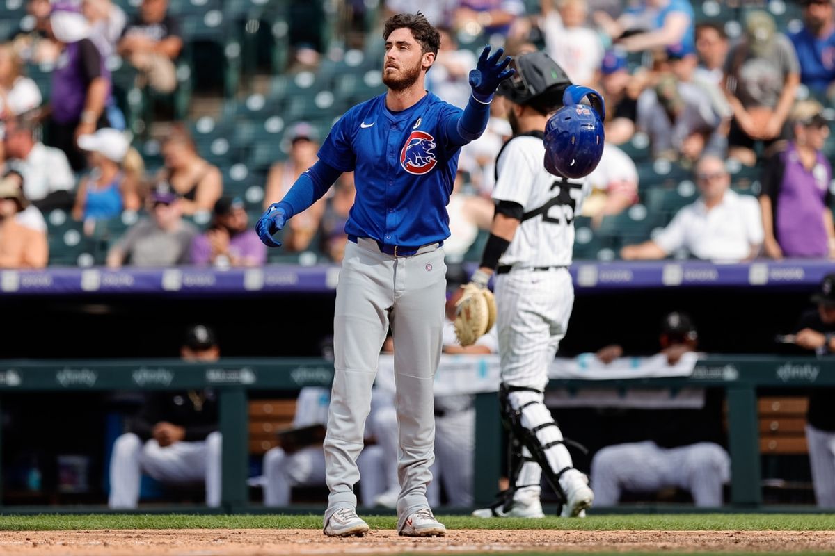 Sep 15, 2024; Denver, Colorado, USA; Chicago Cubs right fielder Cody Bellinger (24) tosses his helmet after striking out with the bases loaded in the ninth inning against the Colorado Rockies at Coors Field. Mandatory Credit: Isaiah J. Downing-Imagn Images