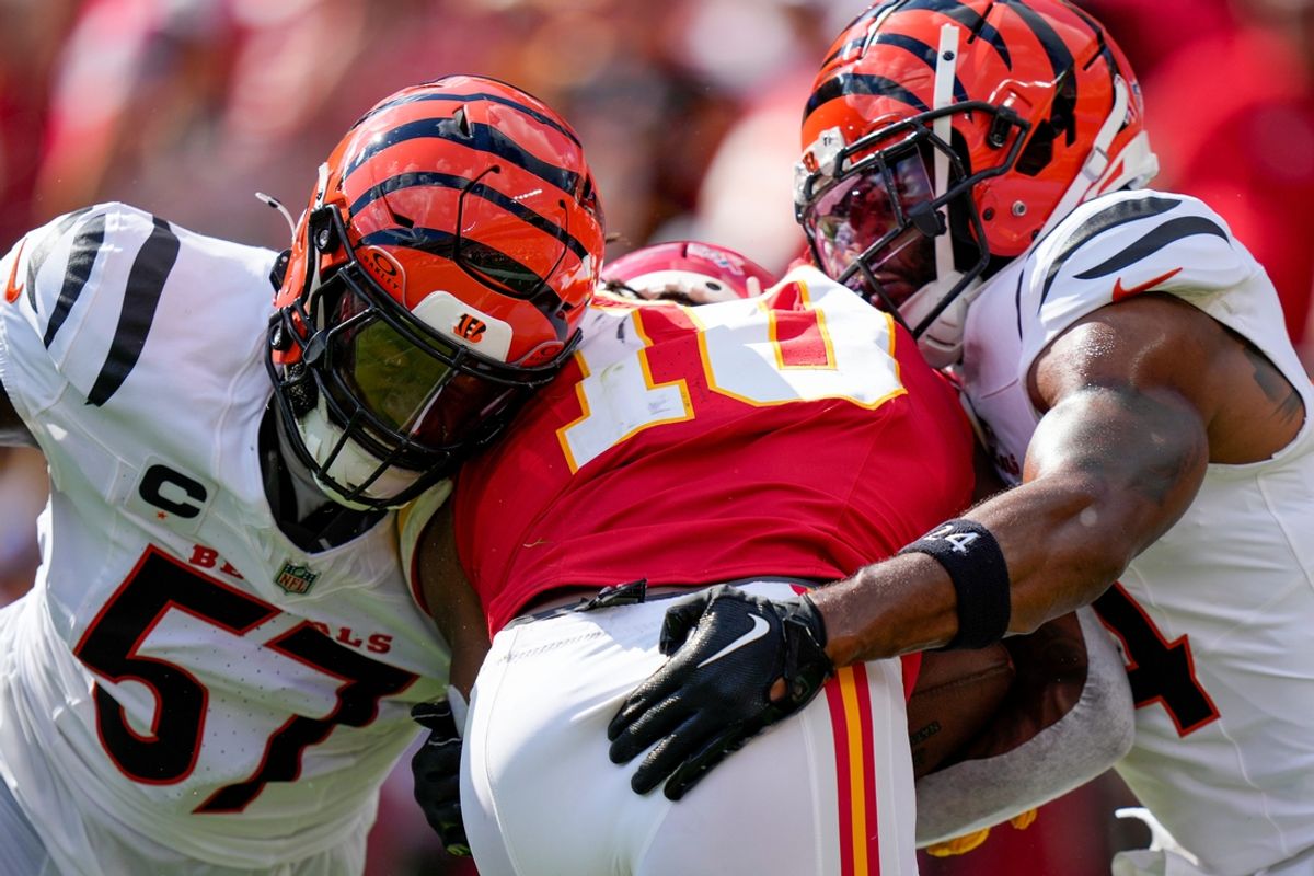 Kansas City Chiefs running back Isiah Pacheco (10) is wrapped up by Cincinnati Bengals linebacker Germaine Pratt (57) and safety Vonn Bell (24) in the first quarter of the NFL Week 2 game between the Kansas City Chiefs and the Cincinnati Bengals at Arrowhead Stadium in Kansas City on Sunday, Sept. 15, 2024. The Bengals led 16-10 at halftime.