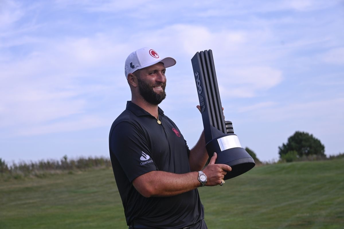 Sep 15, 2024; Bolingbrook, Illinois, USA; Jon Rahm of the Legion XIII holds the team trophy after winning the LIV Golf Chicago tournament at Bolingbrook Golf Club. Mandatory Credit: Matt Marton-Imagn Images