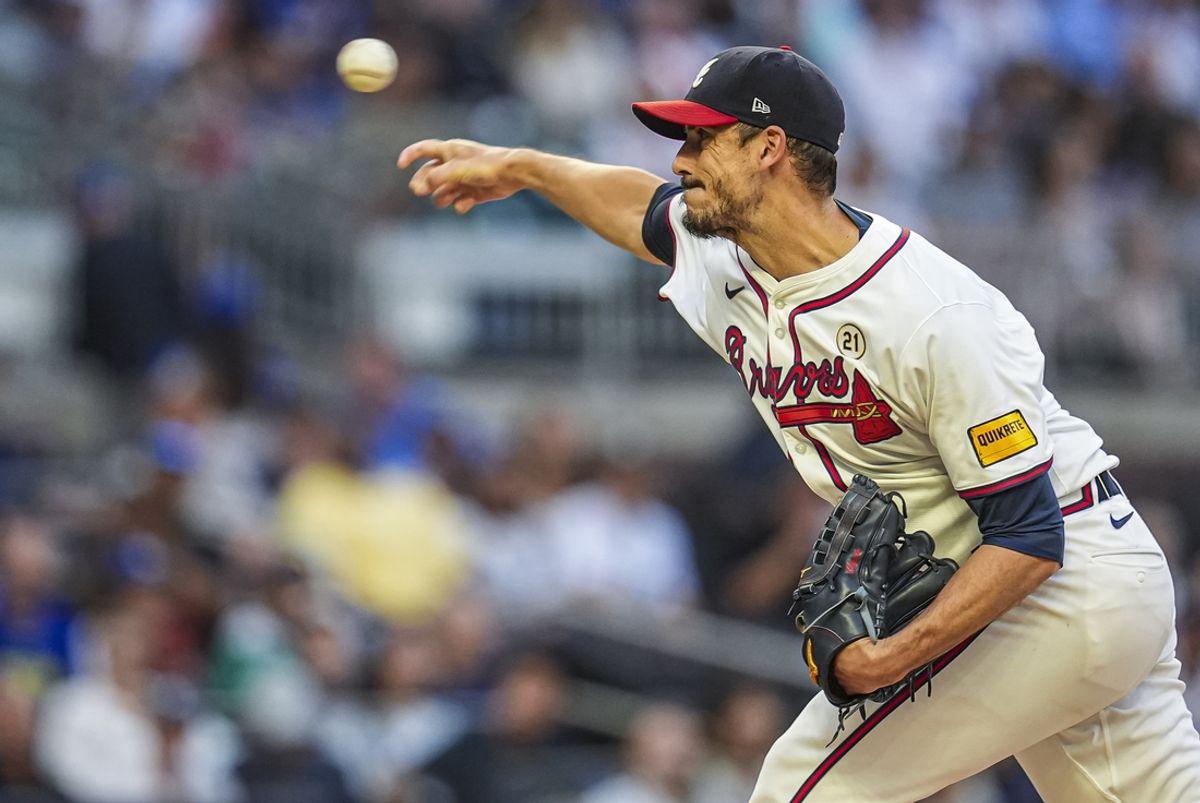 Sep 15, 2024; Cumberland, Georgia, USA; Atlanta Braves starting pitcher Charlie Morton (50) pitches against the Los Angeles Dodgers during the first inning at Truist Park. Mandatory Credit: Dale Zanine-Imagn Images