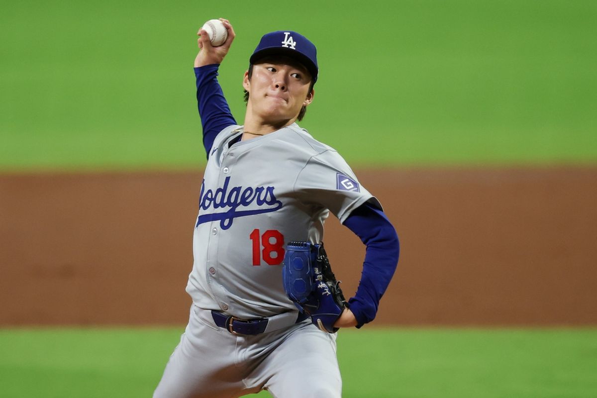 Sep 16, 2024; Atlanta, Georgia, USA; Los Angeles Dodgers starting pitcher Yoshinobu Yamamoto (18) throws against the Atlanta Braves in the third inning at Truist Park. Mandatory Credit: Brett Davis-Imagn Images