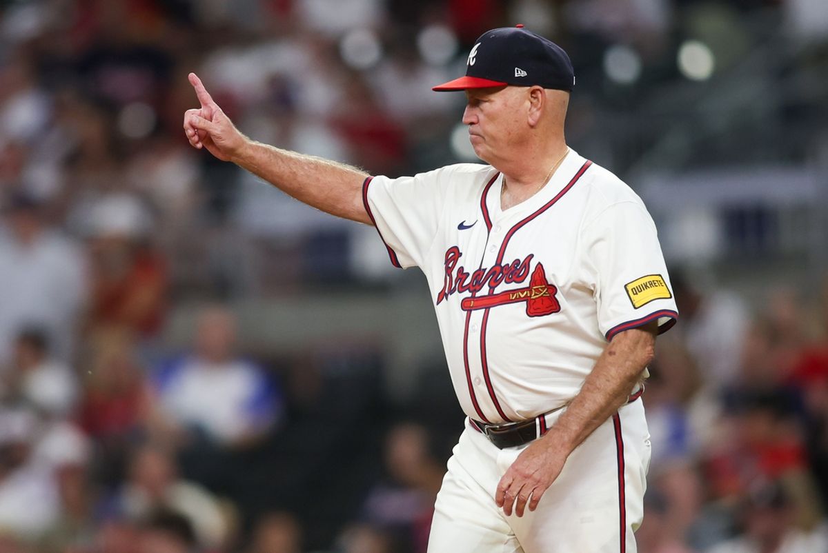 Sep 16, 2024; Atlanta, Georgia, USA; Atlanta Braves manager Brian Snitker (43) makes a pitching change against the Los Angeles Dodgers in the seventh inning at Truist Park. Mandatory Credit: Brett Davis-Imagn Images