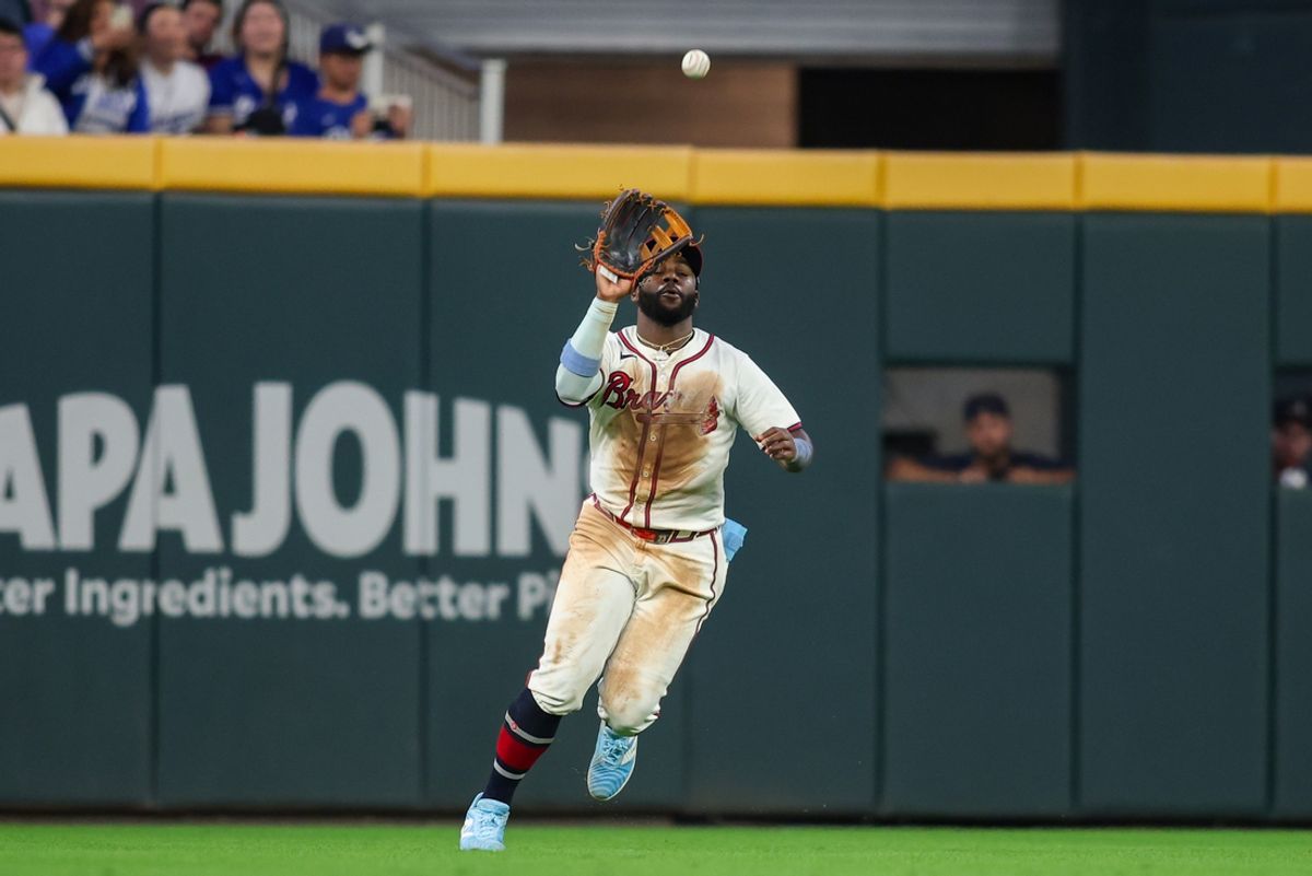 Sep 16, 2024; Atlanta, Georgia, USA; Atlanta Braves center fielder Michael Harris II (23) catches a fly ball against the Los Angeles Dodgers in the seventh inning at Truist Park. Mandatory Credit: Brett Davis-Imagn Images