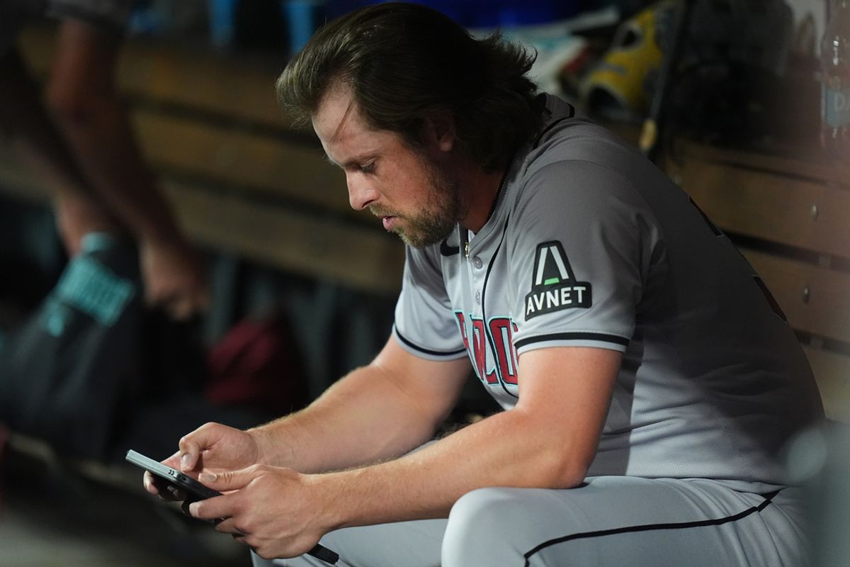 Sep 16, 2024; Denver, Colorado, USA; Arizona Diamondbacks starting pitcher Merrill Kelly (29) following being pulled from the mound in the seventh inning against the Colorado Rockies at Coors Field. Mandatory Credit: Ron Chenoy-Imagn Images