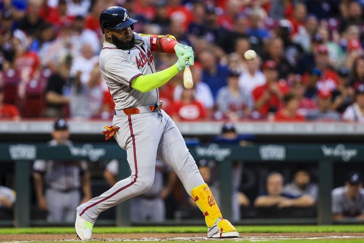 Sep 17, 2024; Cincinnati, Ohio, USA; Atlanta Braves designated hitter Marcell Ozuna (20) hits a single against the Cincinnati Reds in the first inning at Great American Ball Park. Mandatory Credit: Katie Stratman-Imagn Images