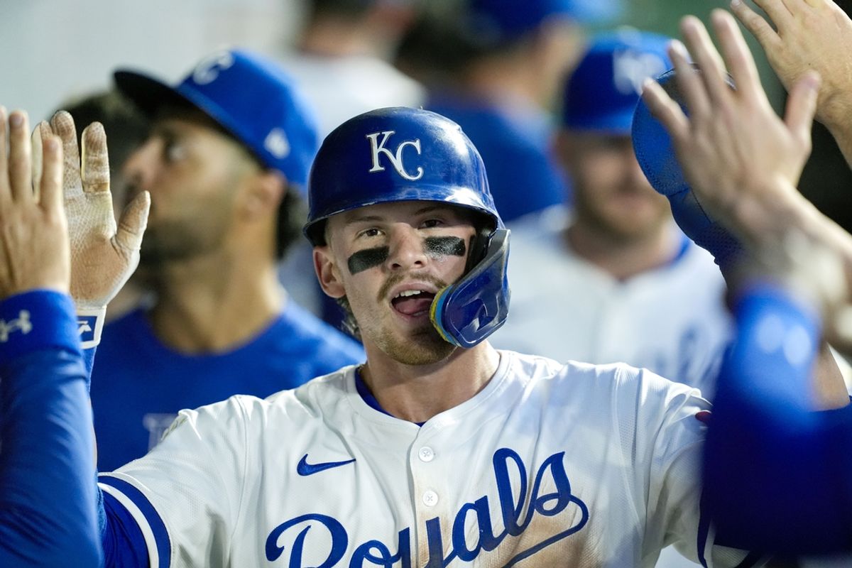 Sep 17, 2024; Kansas City, Missouri, USA; Kansas City Royals shortstop Bobby Witt Jr. (7) is congratulated by teammates after scoring a run during the third inning against the Detroit Tigers at Kauffman Stadium. Mandatory Credit: Jay Biggerstaff-Imagn Images