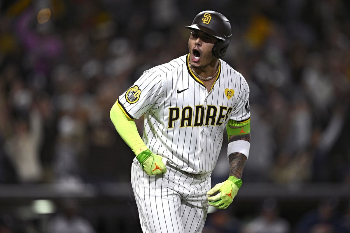 Sep 17, 2024; San Diego, California, USA; San Diego Padres third baseman Manny Machado (13) celebrates after hitting a two-run home run against the Houston Astros during the sixth inning at Petco Park. Mandatory Credit: Orlando Ramirez-Imagn Images
