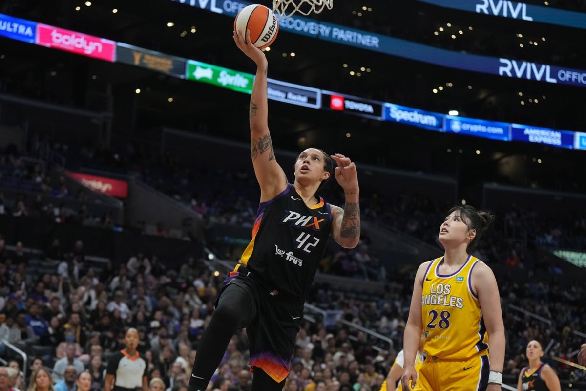 Sep 17, 2024; Los Angeles, California, USA; Phoenix Mercury center Brittney Griner (42) shoots the ball against LA Sparks center Li Yueru (28) in the first half at Crypto.com Arena. Mandatory Credit: Kirby Lee-Imagn Images