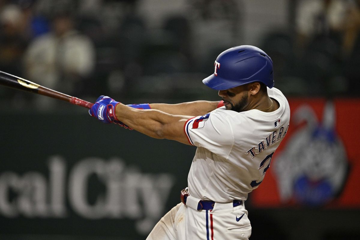 Sep 17, 2024; Arlington, Texas, USA; Texas Rangers center fielder Leody Taveras (3) hits a two run home run against the Toronto Blue Jays during the game at Globe Life Field. Mandatory Credit: Jerome Miron-Imagn Images