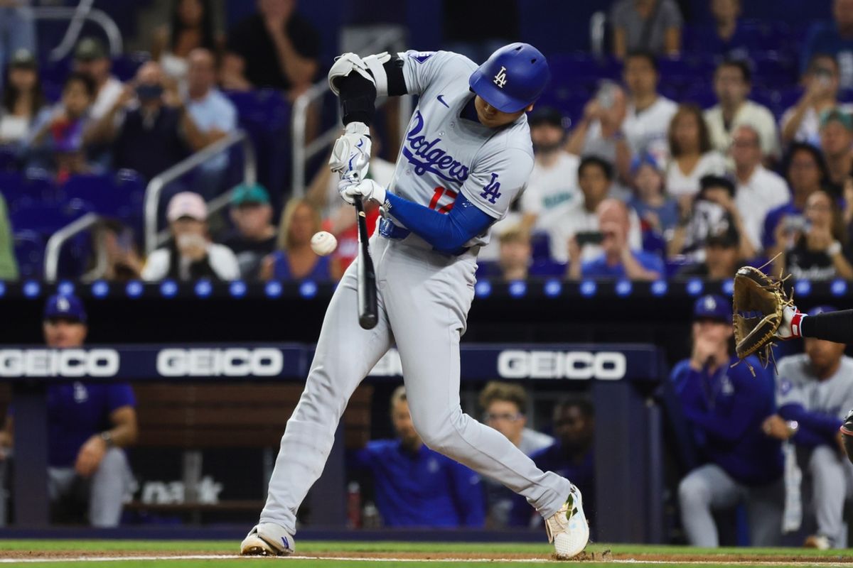 Sep 18, 2024; Miami, Florida, USA; Los Angeles Dodgers designated hitter Shohei Ohtani (17) hits a single against the Miami Marlins during the first inning at loanDepot Park. Mandatory Credit: Sam Navarro-Imagn Images