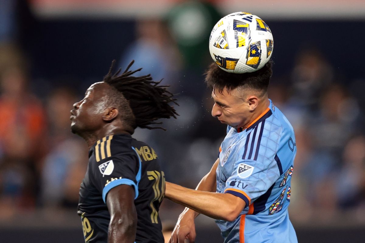 Sep 18, 2024; New York, New York, USA; New York City FC forward Agustin Ojeda (26) battles for a header against Philadelphia Union defender Olivier Mbaizo (15) during the first half at Yankee Stadium. Mandatory Credit: Vincent Carchietta-Imagn Images