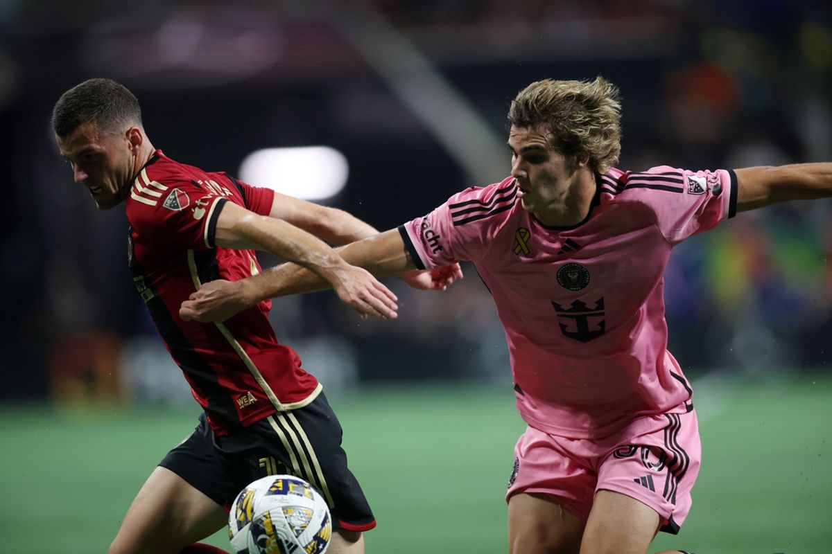 Sep 18, 2024; Atlanta, Georgia, USA; Inter Miami CF midfielder Benjamin Cremaschi (30) and Atlanta United defender Brooks Lennon (11) battle for the ball in the first half at Mercedes-Benz Stadium. Mandatory Credit: Brett Davis-Imagn Images