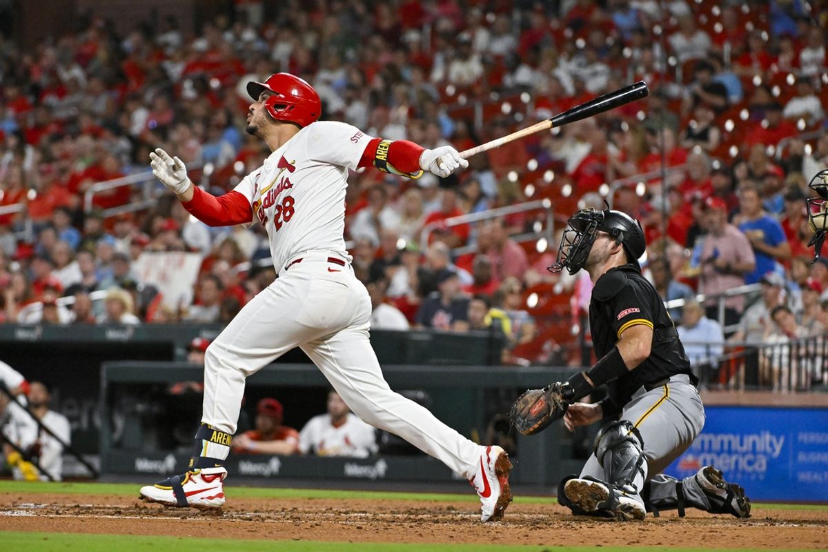 Sep 18, 2024; St. Louis, Missouri, USA;  St. Louis Cardinals third baseman Nolan Arenado (28) hits a one run single against the Pittsburgh Pirates during the third inning at Busch Stadium. Mandatory Credit: Jeff Curry-Imagn Images