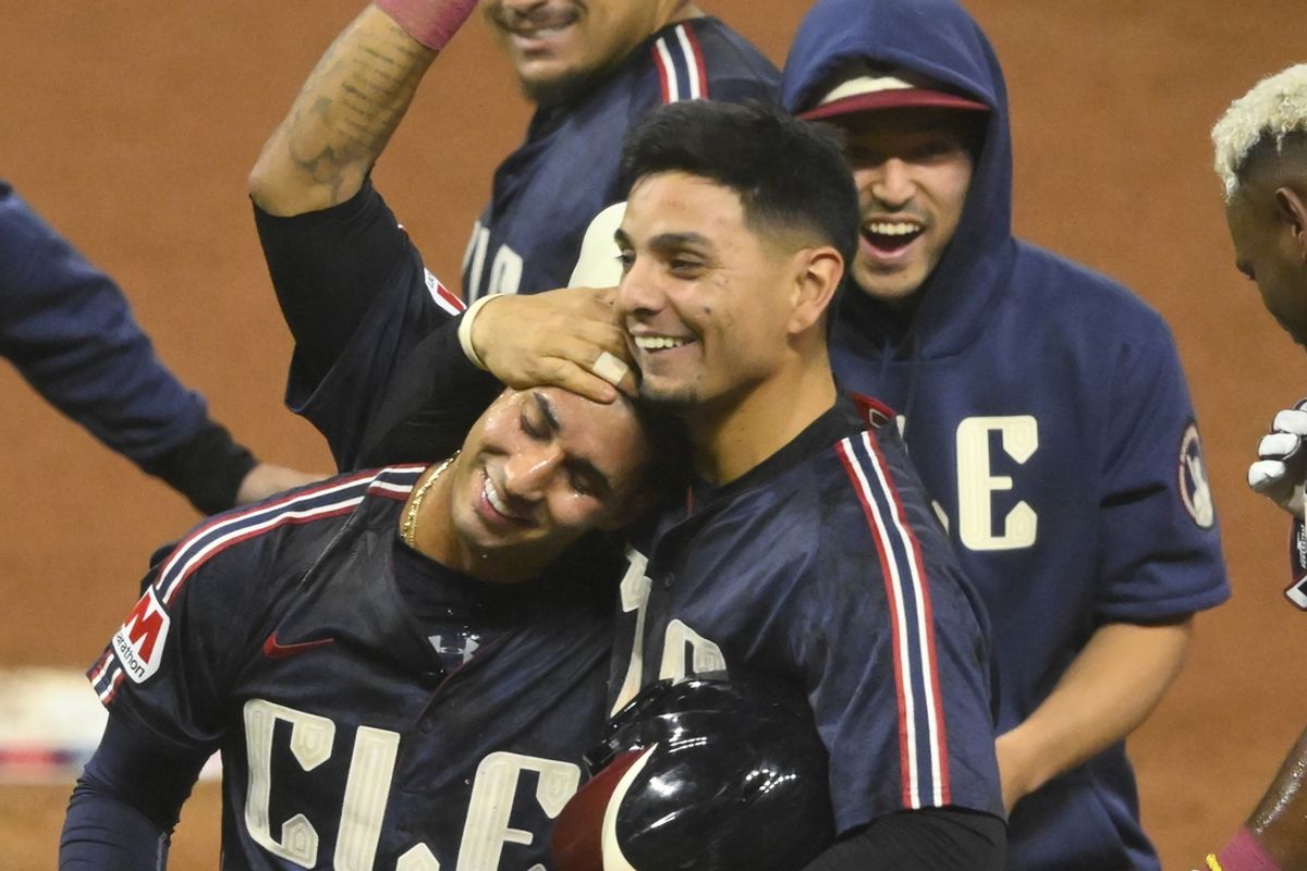 Sep 18, 2024; Cleveland, Ohio, USA; Cleveland Guardians shortstop Brayan Rocchio (left) celebrates his game-winning RBI single with second baseman Andres Gimenez (center) and Steven Kwan (38) in the tenth inning against the Minnesota Twins at Progressive Field. Mandatory Credit: David Richard-Imagn Images
