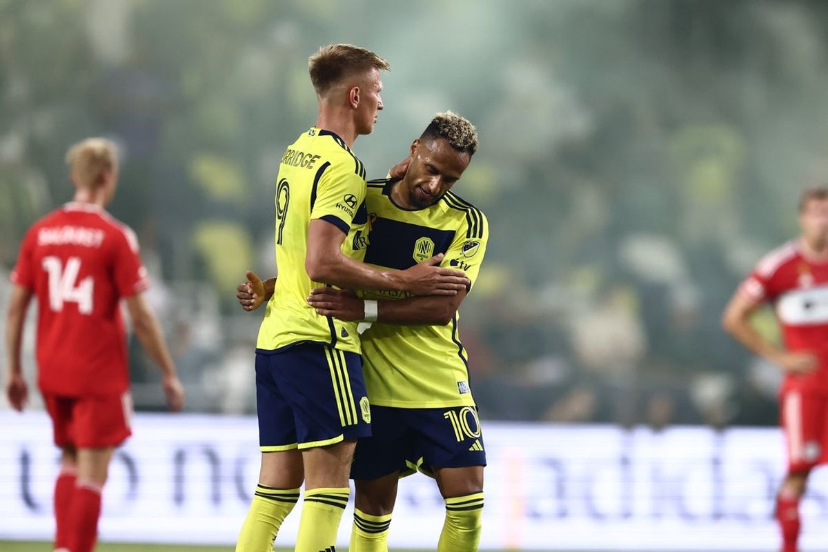 Sep 18, 2024; Nashville, Tennessee, USA; Nashville SC forward Sam Surridge (9) and Nashville SC midfielder Hany Mukhtar (10) celebrate a goal in the first half against Chicago Fire at Geodis Park. Mandatory Credit: Casey Gower-Imagn Images