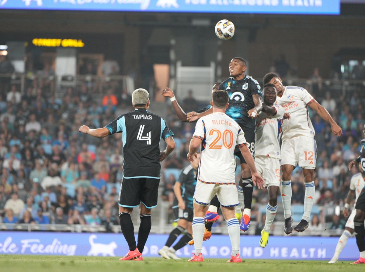 Sep 18, 2024; Saint Paul, Minnesota, USA; Minnesota United defender Jefferson Diaz (28) battles FC Cincinnati defender Miles Robinson (12) for a header during the second half at Allianz Field. Mandatory Credit: Matt Blewett-Imagn Images