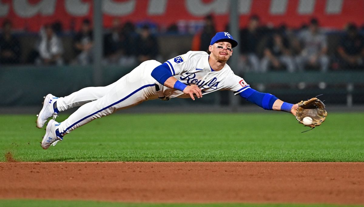 Sep 18, 2024; Kansas City, Missouri, USA;  Kansas City Royals shortstop Bobby Witt Jr. (7) dives for the ball in the seventh inning against the Detroit Tigers at Kauffman Stadium. Mandatory Credit: Peter Aiken-Imagn Images
