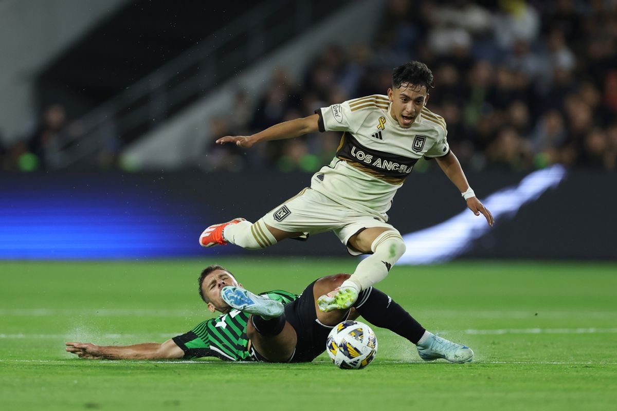 Sep 18, 2024; Los Angeles, California, USA; LAFC defender Erik Duenas (18) and Austin FC forward Diego Rubio (14) battle for the ball in the first half at BMO Stadium. Mandatory Credit: Ryan Sun-Imagn Images