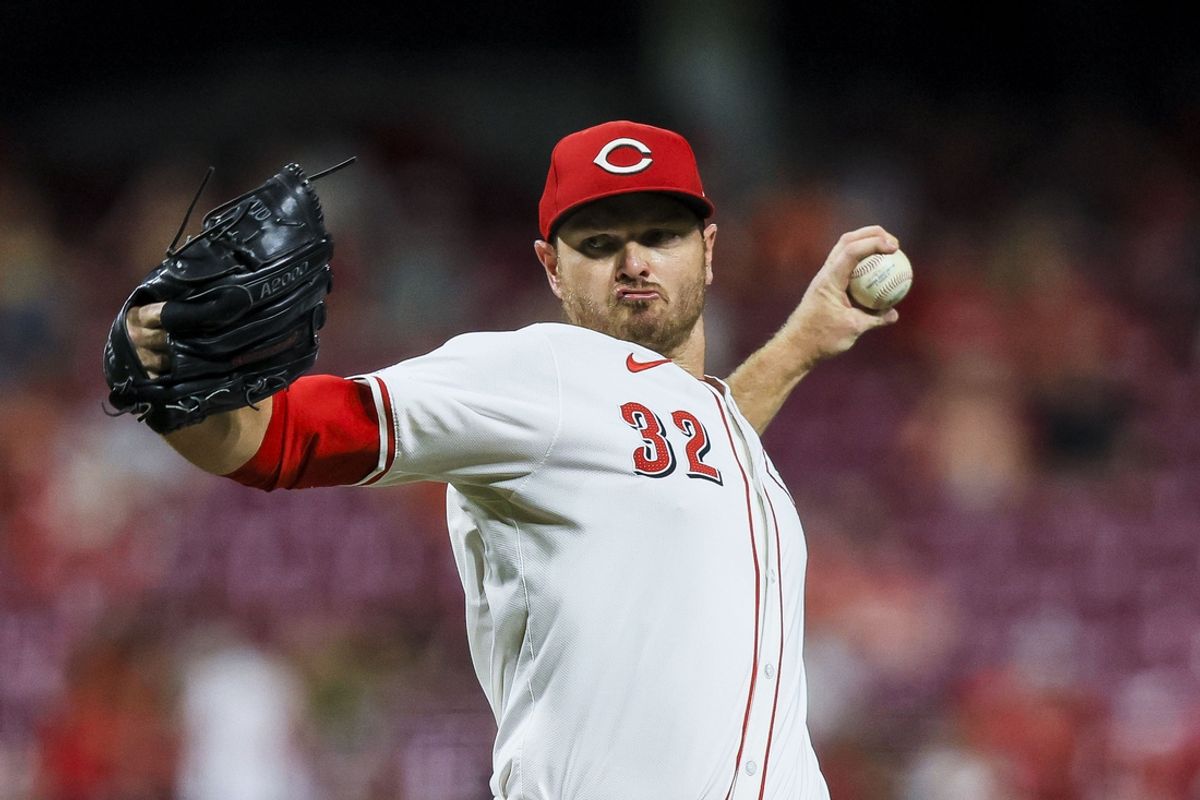 Sep 18, 2024; Cincinnati, Ohio, USA; Cincinnati Reds relief pitcher Justin Wilson (32) pitches against the Atlanta Braves in the eighth inning at Great American Ball Park. Mandatory Credit: Katie Stratman-Imagn Images
