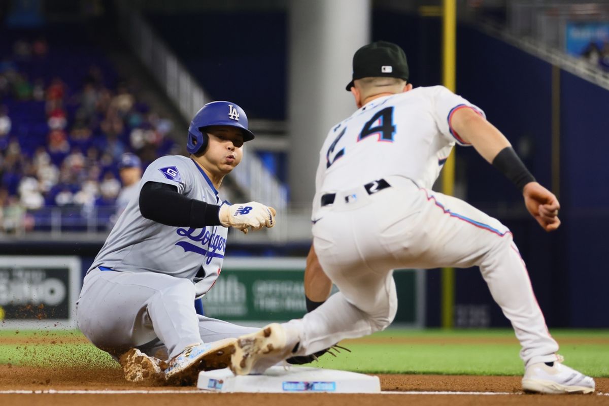 Sep 19, 2024; Miami, Florida, USA; Los Angeles Dodgers designated hitter Shohei Ohtani (17) steals third base against the Miami Marlins during the first inning at loanDepot Park. Mandatory Credit: Sam Navarro-Imagn Images