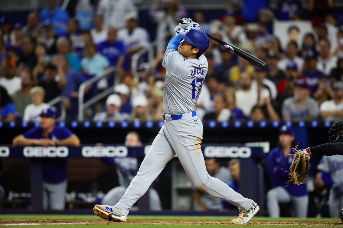 Sep 19, 2024; Miami, Florida, USA; Los Angeles Dodgers designated hitter Shohei Ohtani (17) hits a two-run home run against the Miami Marlins during the sixth inning at loanDepot Park. Mandatory Credit: Sam Navarro-Imagn Images