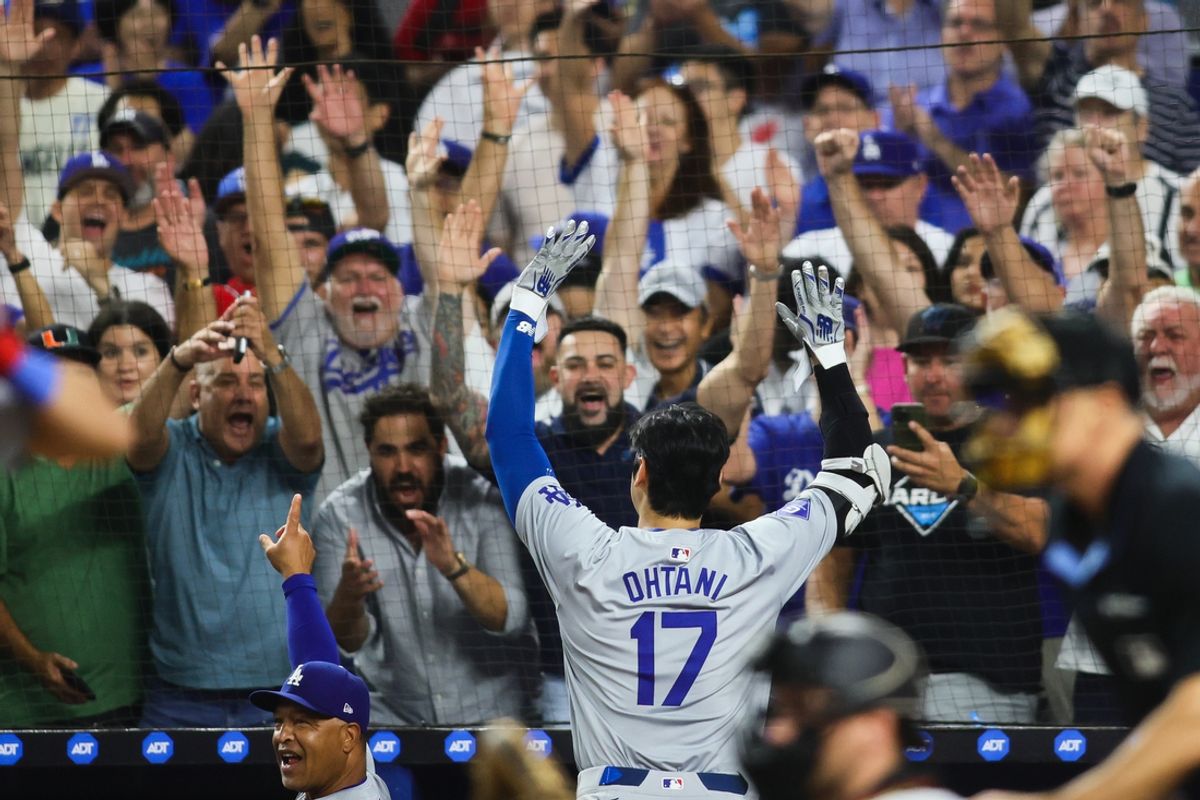 Sep 19, 2024; Miami, Florida, USA; Los Angeles Dodgers designated hitter Shohei Ohtani (17) reacts to a standing ovation from the fans after hitting his 50th home run of the season against the Miami Marlins during the seventh inning at loanDepot Park. Mandatory Credit: Sam Navarro-Imagn Images