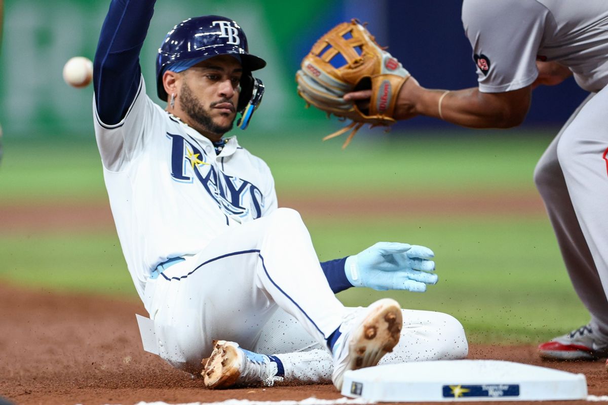 Sep 19, 2024; St. Petersburg, Florida, USA; Tampa Bay Rays outfielder Jose Siri (22) slides into third base against the Boston Red Sox in the third inning at Tropicana Field. Mandatory Credit: Nathan Ray Seebeck-Imagn Images