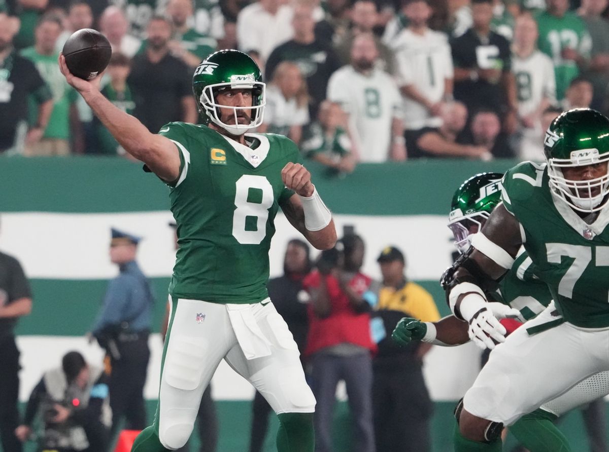 Sep 19, 2024; East Rutherford, New Jersey, USA;  New York Jets quarterback Aaron Rodgers (8)  throws against the New England Patriots in the 1st quarter at MetLife Stadium. Mandatory Credit: Robert Deutsch-Imagn Images