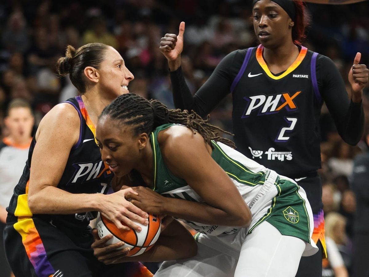 Phoenix Mercury guard Diana Taurasi (3) fights with Seattle Storm forwards Nneka Ogwumike (3) for the ball on Sept. 19, 2024 at Footprint Center in Phoenix.