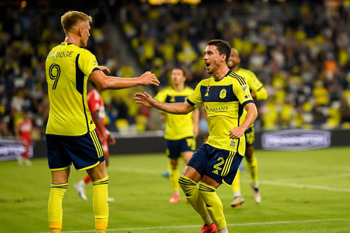 Sep 18, 2024; Nashville, Tennessee, USA;  Nashville SC defender Daniel Lovitz (2) celebrates the goal of forward Sam Surridge (9) against the Chicago Fire during the first half at Geodis Park. Mandatory Credit: Steve Roberts-Imagn Images