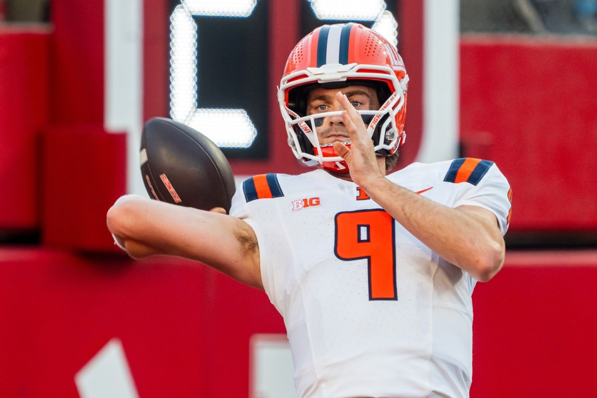 Sep 20, 2024; Lincoln, Nebraska, USA; Illinois Fighting Illini quarterback Luke Altmyer (9) warms up before a game against the Nebraska Cornhuskers at Memorial Stadium. Mandatory Credit: Dylan Widger-Imagn Images