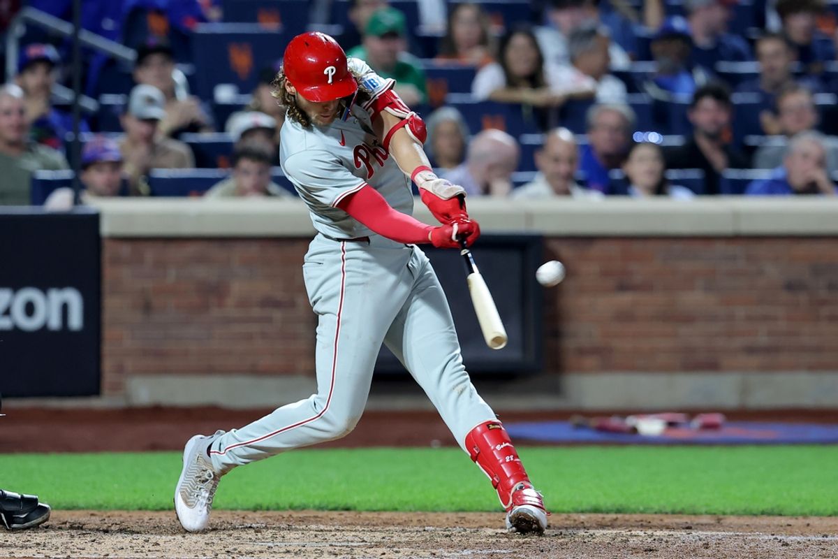 Sep 20, 2024; New York City, New York, USA; Philadelphia Phillies third baseman Alec Bohm (28) hits a three run home run against the New York Mets during the fourth inning at Citi Field. Mandatory Credit: Brad Penner-Imagn Images