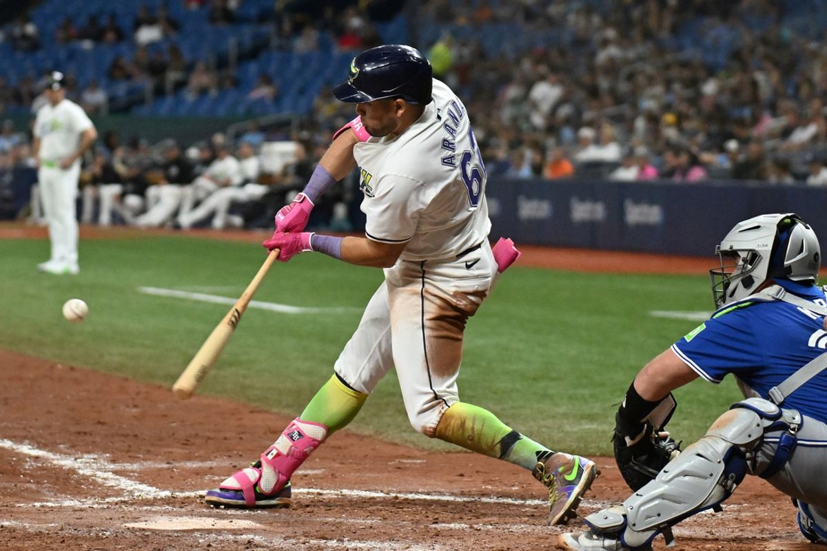 Sep 20, 2024; St. Petersburg, Florida, USA; Tampa Bay Rays second baseman Jonathan Aranda (62) hits a solo home run in the sixth against the Toronto Blue Jays at Tropicana Field. Mandatory Credit: Jonathan Dyer-Imagn Images